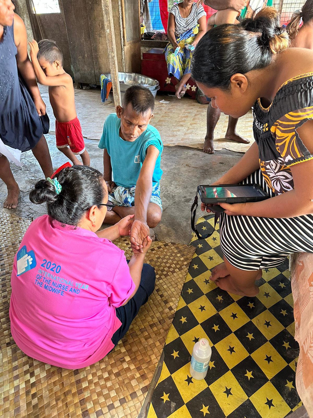 Skin examination during the prevalence survey in Kiribati, WSP 2023